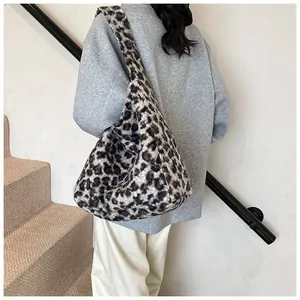 Close-up of leopard print faux fur tote bag showing texture and plush fabric shoulder strap