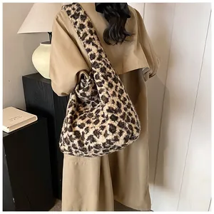 Close-up of fluffy leopard print velvet shoulder bag with soft plush texture details