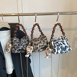 Chic leopard print plush handbags with amber beaded handles and kitty doll charms