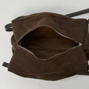 Large dark brown suede tote bag with silver zipper and spacious interior for daily commute