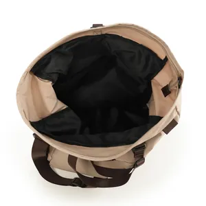 Minimalist large capacity canvas shoulder bag in beige with brown straps and pockets