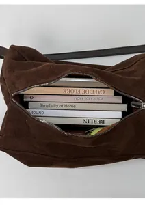 Spacious dark brown suede tote bag showing large interior capacity for daily essentials