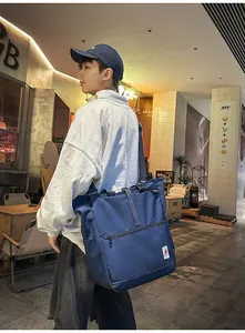 Detail view of navy blue large capacity canvas tote bag with adjustable shoulder strap