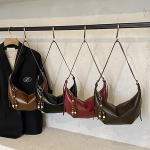 Retro crescent shoulder bag in four colors with stylish beaded tassel details