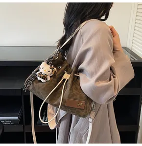 Detail of leopard print bucket bag with drawstring closure and white slim strap