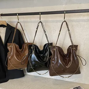 Chic quilted chain tote bag in coffee, black and brown colors for daily commuting
