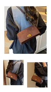 Détail du sac bandoulière vintage marron avec un fermoir rotatif ovale en métal doré