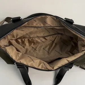 Top view of large capacity suede tote bag showing olive green satin lining and pockets