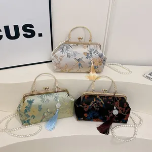 Elegant Chinese satin embroidered handbags with floral patterns and pearl chains