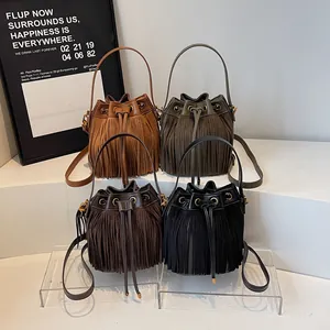 Chic suede fringe bucket bags in brown, green, coffee, and black with drawstring closure