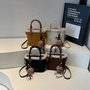 Plush faux suede bucket bags in four colors with cozy lamb wool trim and star charms