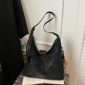 Retro black leather hobo tote bag with long shoulder straps and heart floral charms