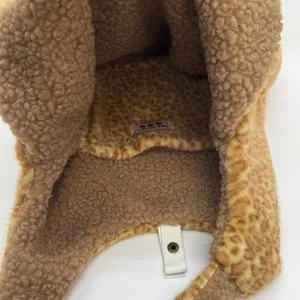 Leopard print faux fur winter hat with warm teddy fleece lining and snap button strap