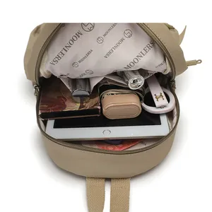 Minimalist beige backpack with large capacity interior showing tablet storage space