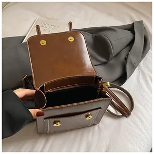 Vintage brown PU leather backpack with magnetic flap and white stitching for women