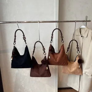 Retro matte tote bags in four colors with wooden bead handles and fuzzy pompom charms