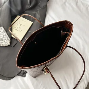 Brown printed tote bag with large capacity and inner zipper pocket for daily commute