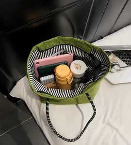 Interior view of large capacity green checkerboard tote bag showing spacious storage