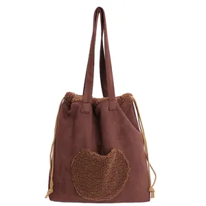 Vintage brown suede tote bag for women with plush heart detail and drawstring closure