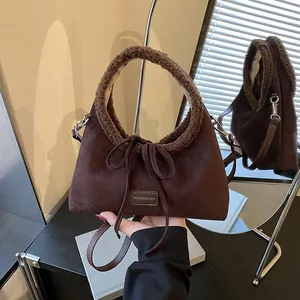 Retro brown suede handbag with fuzzy sheepskin trim and adjustable shoulder strap