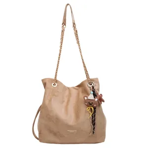 Brown suede shoulder bag with gold chain strap and cute bear charm pendant