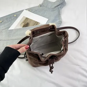 Korean style dark brown drawstring backpack with plush ball and inner lining