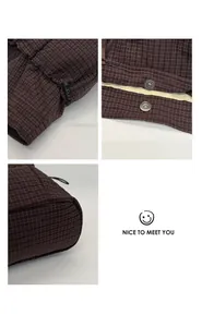 Detail view of dark plaid tote bag with drawstring toggles and padded stitching texture