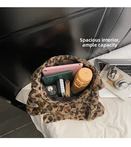 Macro shot of large capacity interior for leopard plush tote bag with daily items
