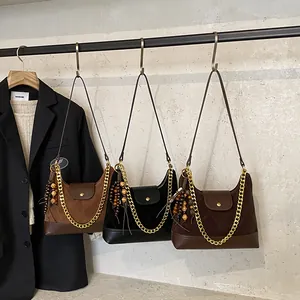 Retro suede shoulder bags with chain straps and geometric wooden charms in three colors
