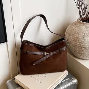 Vintage brown faux suede tote bag with leather strap and metallic buckle detail