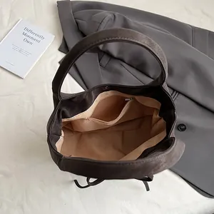 Retro oversized tote bag in dark brown faux leather with spacious interior and bow detail