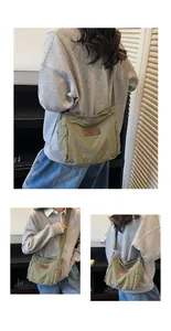 Detail view of military green canvas crossbody bag featuring leather patch and side pockets