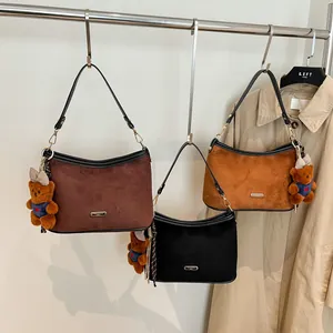 Hobo shoulder bag set with faux fur texture and leopard pattern charms in fall aesthetic