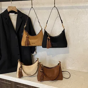 Retro suede half-moon crossbody bag with tassel detail in four stylish colors