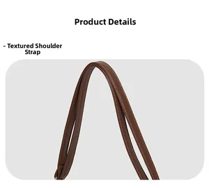 Detailed view of the dark brown leather shoulder strap with premium stitching quality