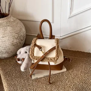 Winter faux suede backpack with plush trim and rabbit pendant for daily commuting