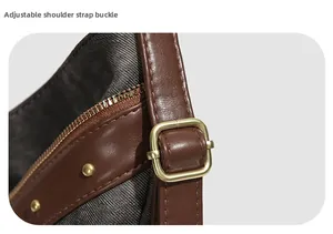 Detail of adjustable strap buckle and gold zipper on dark brown leather tote bag