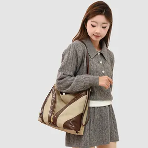 Retro canvas tote bag with brown leather trim and metallic rivets for women
