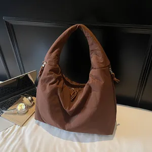 Fashionable dark brown nylon tote bag with drawstring detail and large capacity