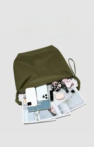 Detailed top view of an olive green tote bag showing spacious interior with daily essentials