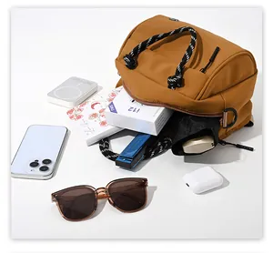 Detailed view of the large capacity interior of this stylish brown crossbody bag