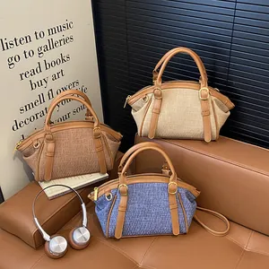 Three retro crossbody bags with woven texture and leather trim on a stylish leather sofa