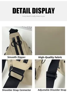 Detail view of khaki nylon crossbody bag featuring round zippers and adjustable strap