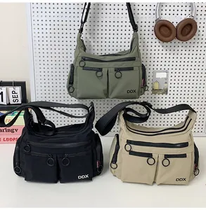 Detailed view of durable nylon crossbody bags with multi-pocket storage and metal pullers
