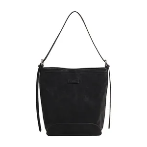 Minimalist black bucket shoulder bag for women with Lilac logo and textured leather finish