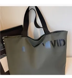 Detailed top view of a dark olive canvas tote bag with black VIGOUR VIVID lettering