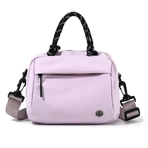 Chic light purple nylon crossbody bag with woven handles and adjustable wide strap