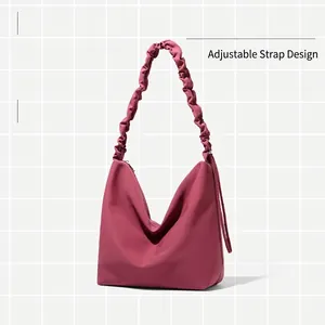 Rose pink shoulder tote bag with adjustable ruched cloud strap and matte texture