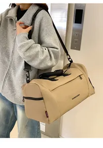 Detail of khaki large capacity Oxford travel bag with handle and adjustable shoulder strap