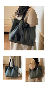 Detailed views of a large olive green canvas tote bag with VIGOURVIVID printed letters